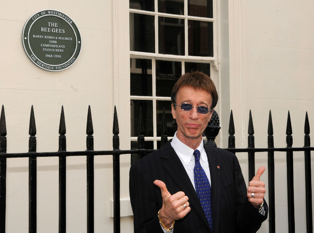Robin Gibb, founding member of the Bee Gees, unveils a plaque honouring the work of the Bee Gees at 67 Brook Street, central London