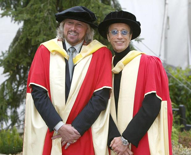 Barry and Robin Gibb pose for photographers