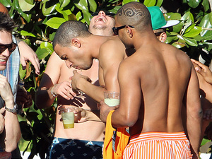 Marvin Humes is egged on by bandmate JB, real name Jonathan Gill, of JLS as he drinks shots by the pool at the Encore, in Las Vegas, Nevada, on the first leg of his bachelor party
Las Vegas