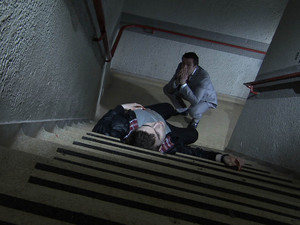 Brendan looks on at Joel's lifeless body.