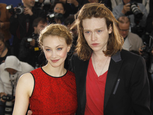 Sarah Gadon and Caleb Landry Jones pose during a photo call for Antiviral.