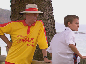 John talks to Jett at the beach.