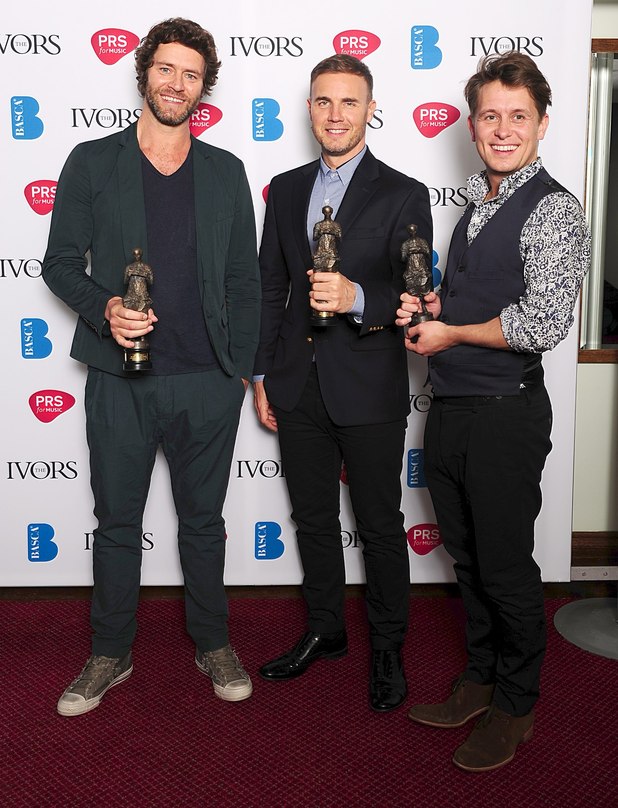 Howard Donald, Gary Barlow, and Mark Owen from Take That