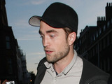 Robert Pattinson arrives for dinner with friends at Claridge's restaurant in London. The Twilight star was celebrating his 26th birthday.
London
