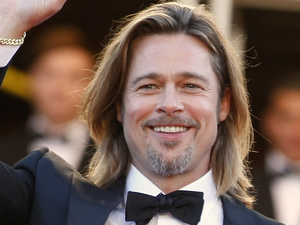Brad Pitt waves as he arrives for the screening of Killing Them Softly at the 65th international Cannes Film Festival