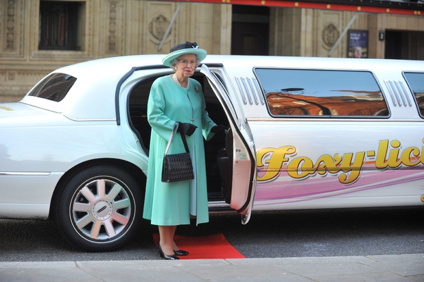 Queen lookalike Mary Reynolds stands near her Foxy Bingo limo