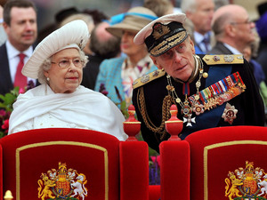 Queen Elizabeth II and Duke of Edinburgh onboard the Spirit of Chartwell during the Diamond Jubilee Pageant on the River Thames in London.