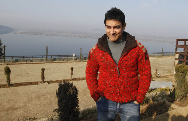 Bollywood actor Aamir Khan poses for a photograph outside his hotel in Srinagar, India, Thursday, Feb. 9, 2012.