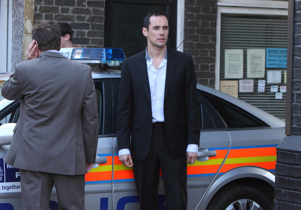 Michael arrives at the police station.