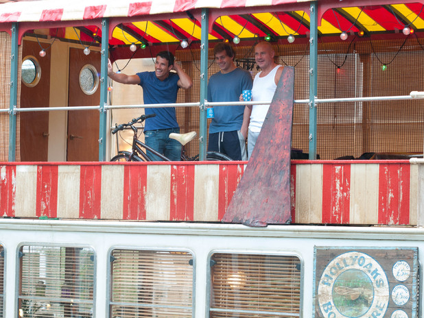 The Savages take residence on their boat.