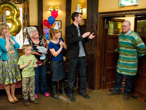After various attempts to coax him into it, Paddy turns up at his suprise birthday in the Woolpack
