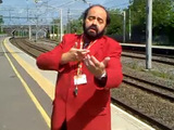 Luciano Pavarotti impersonator sings to rail commuters