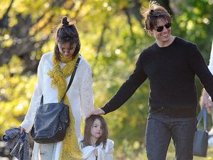 Tom Cruise and Katie Holmes with their daughter daughter Suri in a park together in October 2009