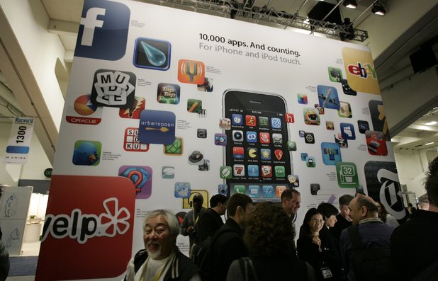 A poster touting apps available for the Apple's iPhone and iPod touch is seen at the Macworld Conference and Expo in San Francisco, Tuesday, Jan. 6, 2009