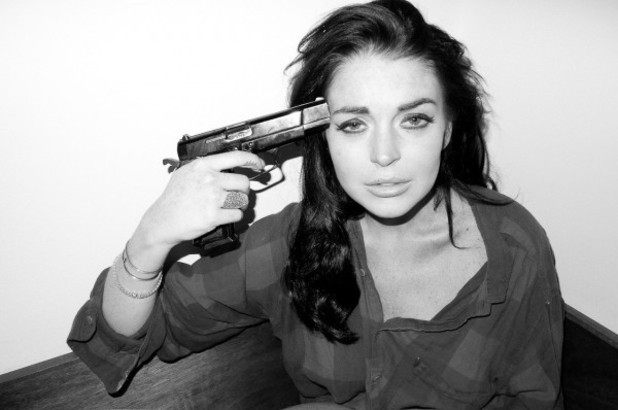 Lindsay Lohan poses with a gun for a Terry Richardson photo shoot