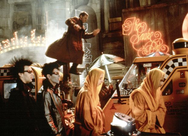 Deckard runs along car rooftops