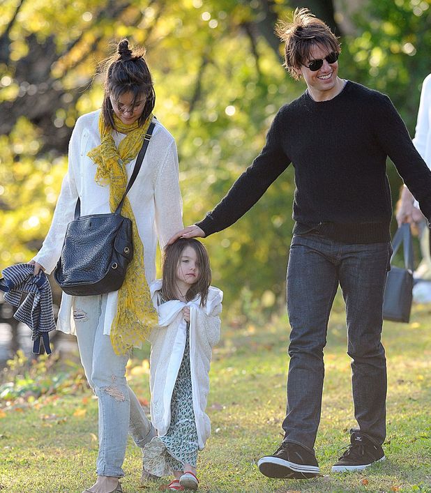 Tom Cruise and Katie Holmes with their daughter daughter Suri in a park together in October 2009