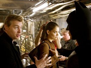 Christopher Nolan directing Batman Begins with Christian Bale (Batman/Bruce Wayne) and Katie Holmes (Rachel Dawes)