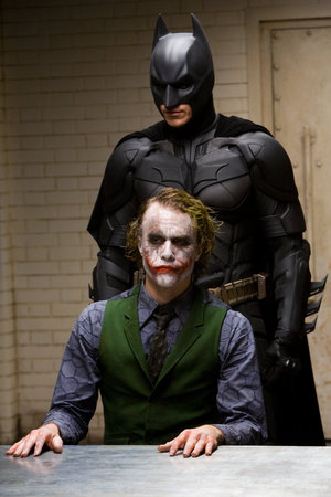 Christian Bale as Batman/Bruce Wayne and Heath Ledger as The Joker in The Dark Knight