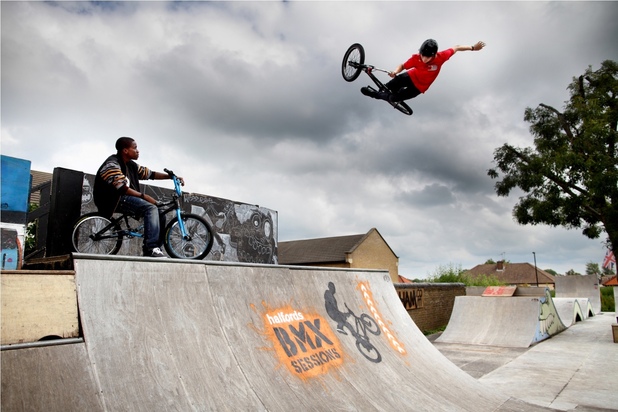 Tinchy Stryder rides a BMX bike