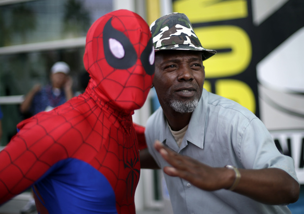 Ray Senore poses with a man dressed as Spiderman