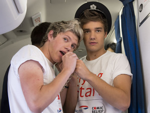 Niall and Liam conduct a quiz for passengers.