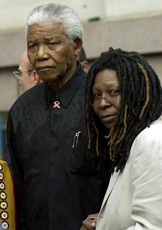 Nelson Mandela stands with Whoopi Goldberg