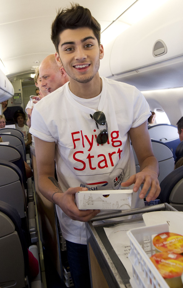 Zayn Malik gets to grips with the snacks trolley.