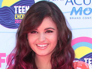 Rebecca Black arrives on the pink carpet at the Teen Choice Awards 2012