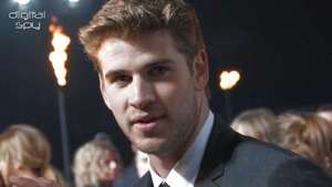 Liam Hemsworth, Josh Hutcherson at the premiere of The Hunger Games