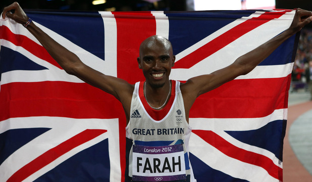 Mo Farah does a victory parade after winning the Men's 10,000m Final.