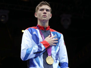 Luke Campbell stands proud with his Men's Boxing Bantam 56kg gold medal.