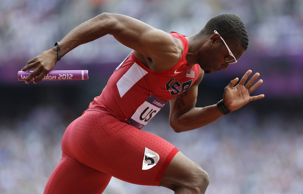 United States' Manteo Mitchell competes in a 4x400-meter relay heat during the athletics in the Olympic Stadium during which he broke his leg