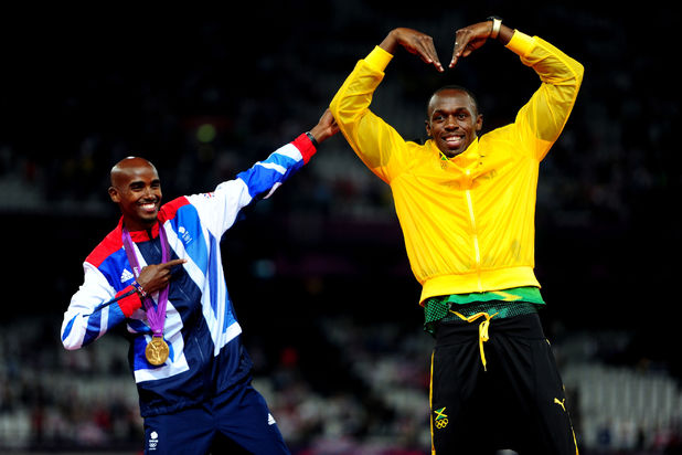 Mo Farah and Usain Bolt celebrate their gold medals and trade each other's poses on the podium.