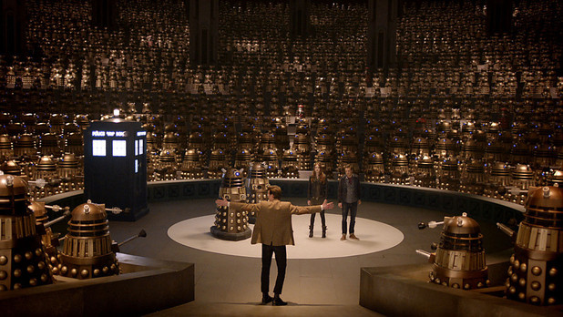 The Doctor, Amy and Rory with Daleks