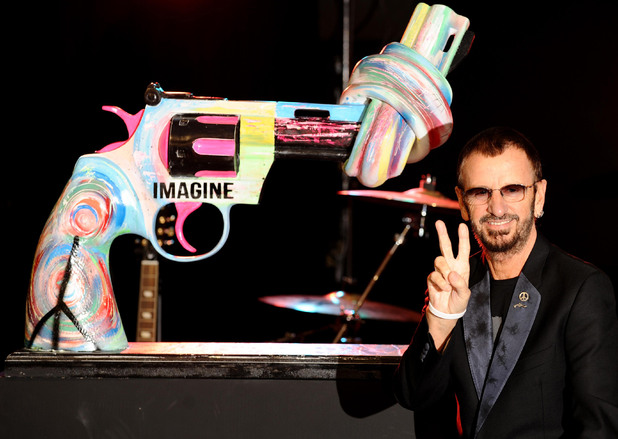 Ringo Starr, with his 'Knotted Gun' statue at the Gibson Guitar Studio, in central London.