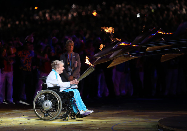 Margaret Maughan lights the Olympic flame