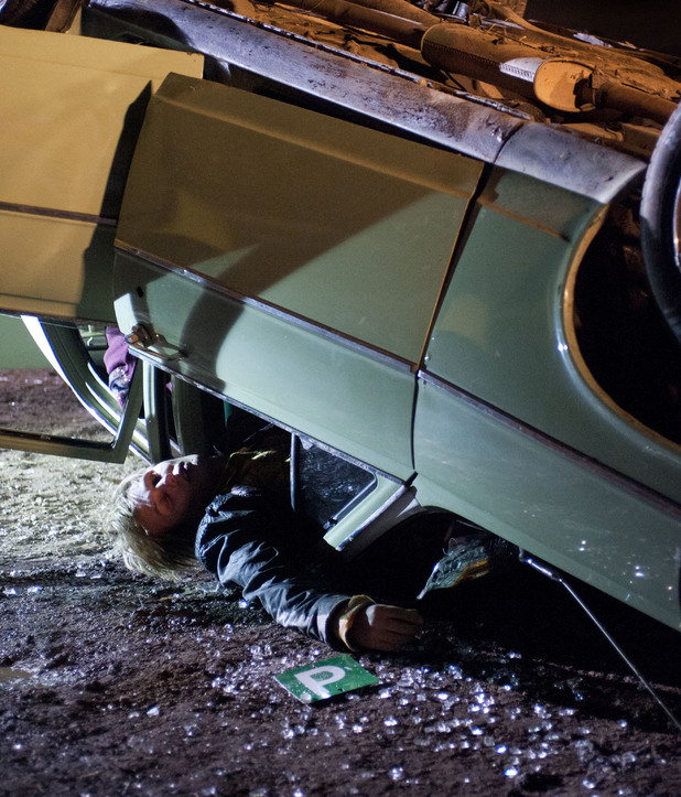 Andrew lies trapped in th ecar.