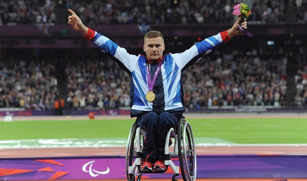 Great Britain's David Weir celebrates with his gold after winning the Men's 800m - T54