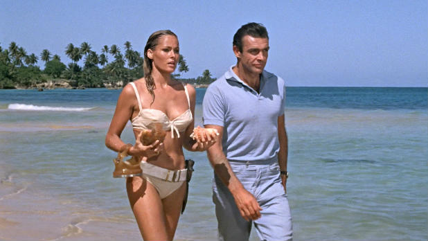 Honey Ryder emerges from the sea in an iconic scene from Sean Connery's first James Bond movie Dr No.