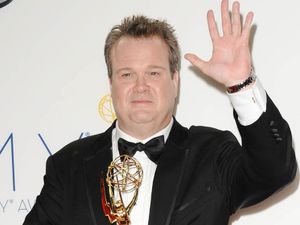 Eric Stonestreet with his Supporting Actor In A Comedy Series award at the 64th Annual Primetime Emmy Awards press room