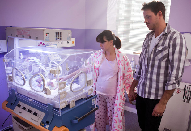 Nancy and Darren watch over the baby.