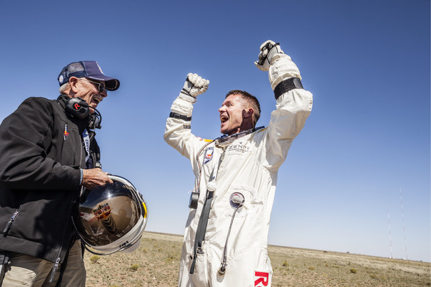 Felix Baumgartner celebrates his successful skydive with Red Bull Stratos life support engineer Mike Todd - New Mexico, October 14, 2012