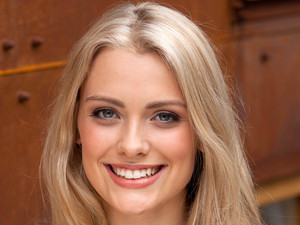 Wallis Day as Holly Cunningham