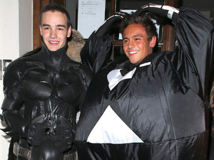 Liam Payne of One Direction dressed as Batman and Tom Daley in a fat skeleton costume
Celebrities at Funky Buddha nightclub for a Halloween party
London, England