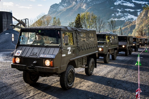 Mititary vehicles move in convoy 