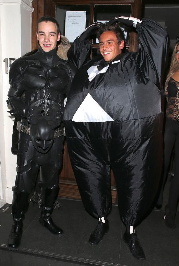 Liam Payne of One Direction dressed as Batman and Tom Daley in a fat skeleton costumeCelebrities at Funky Buddha nightclub for a Halloween partyLondon, England