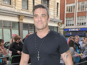 Robbie Williams arriving at the Radio 1 studios.
London, England - 10.09.12
Mandatory Credit: Will Alexander/WENN.com