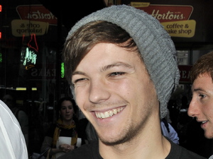 Louis Tomlinson
One Direction exits Toys 'R' Us in Times Square with nerf guns. They also were seen dining at T.G.I. Friday's   New York City
