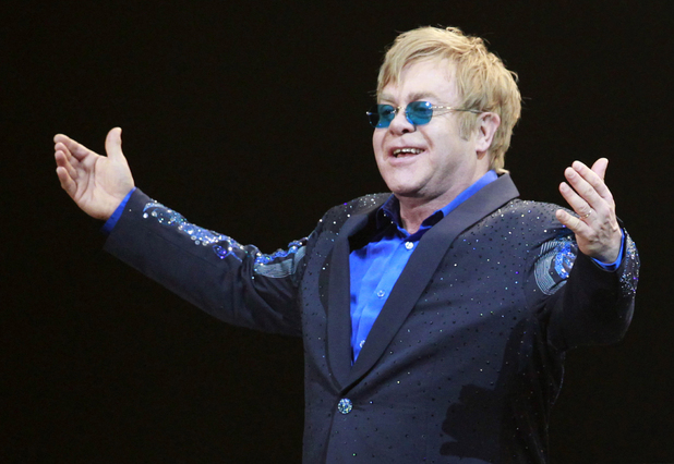 Elton John greets the audience during his concert at Mercedes-Benz Arena in Shanghai.